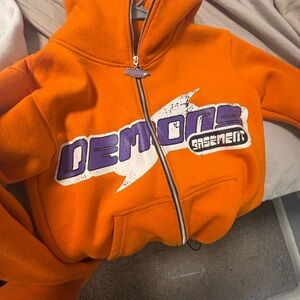 Orange Hoodie with Purple Graphic